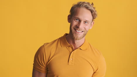 excited man giving thumbs up in studio