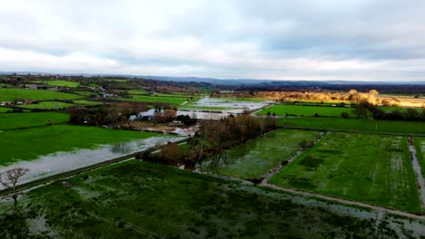 flooding and water damage to fields in somerset, england