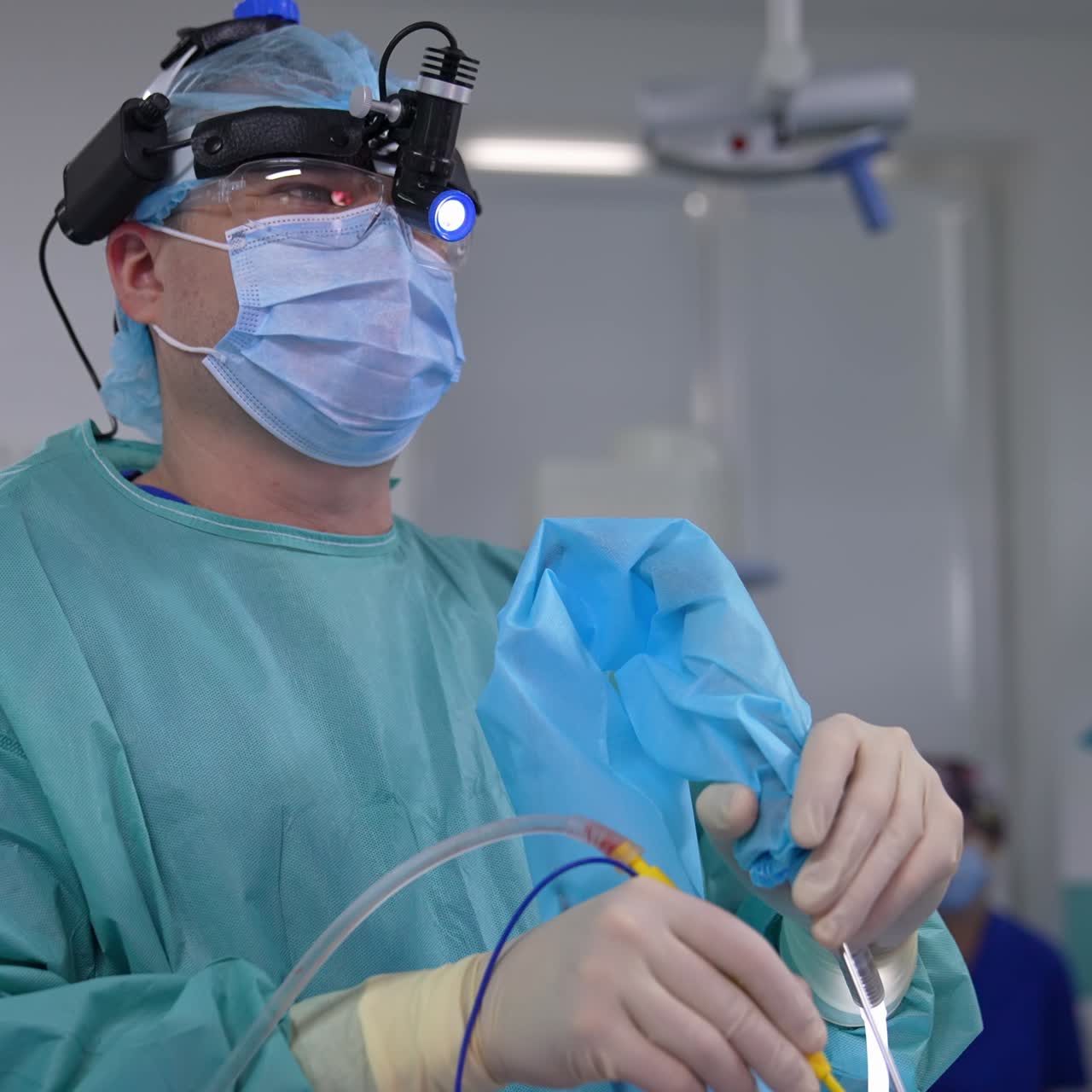 Portrait of professional surgeon specialist. Handsome neurosurgeon in mask working in emergency ward