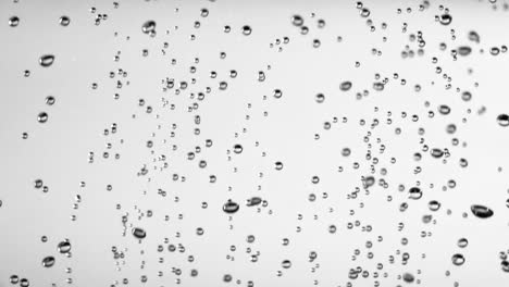 super slow motion shot of air bubbles stream in water isolated on black at 1000fps super slow motion shot of air bubbles stream in water isolated on black at 1000fps filmed with high speed cinema camera