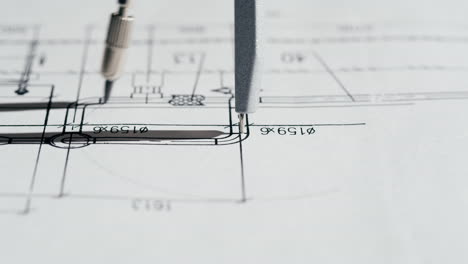 drafting compass on technical drawing