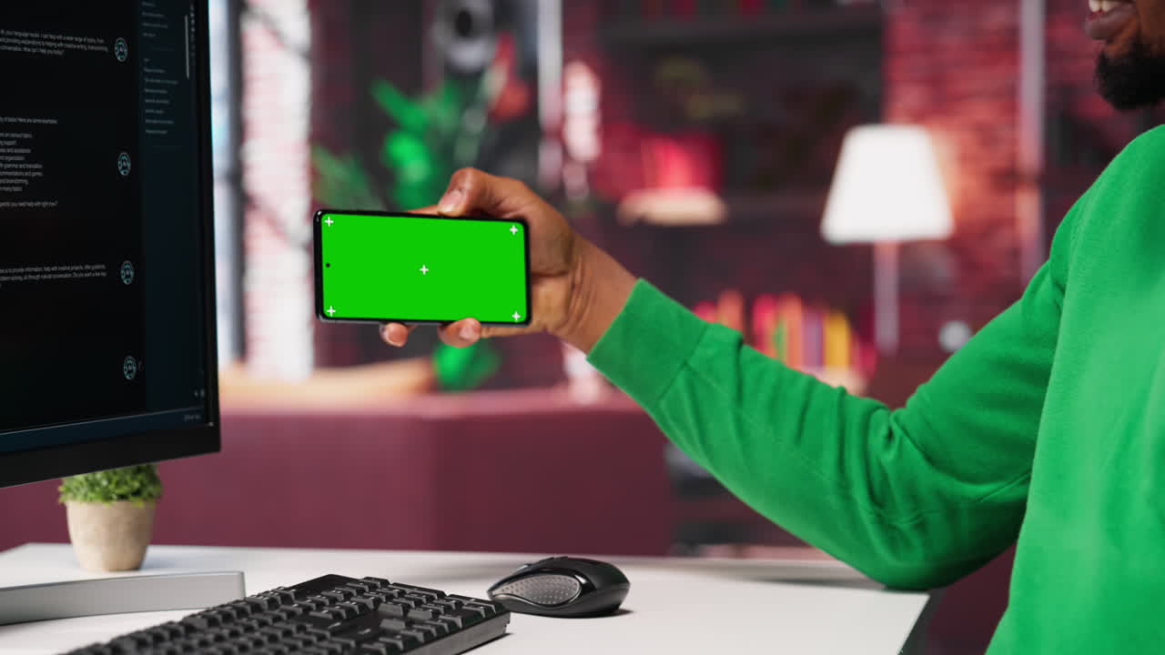 Vertical Video African american man engaging with AI chatbot next to chroma key