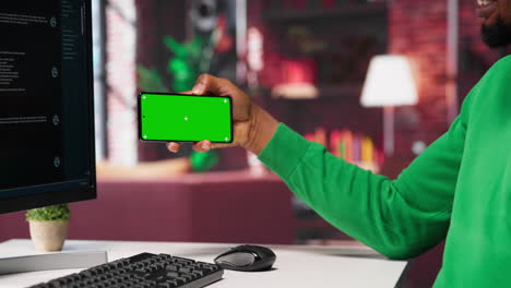 vertical video african american man engaging with ai chatbot next to chroma key