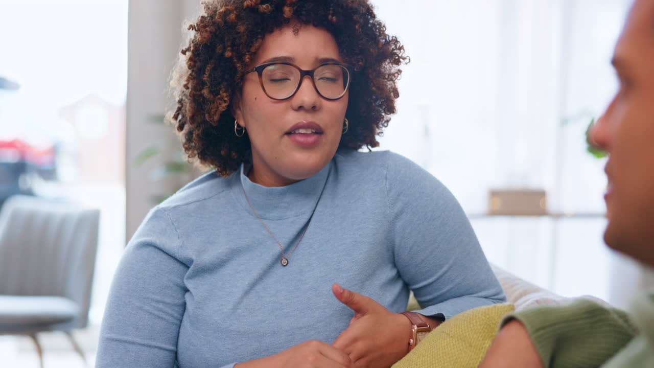Love, talking and couple on a couch