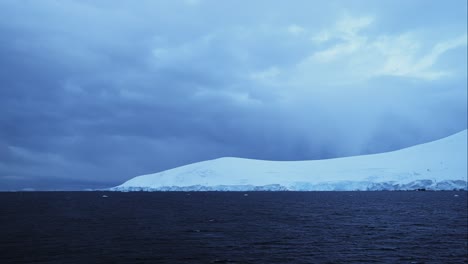 Ice-Cap-and-Glacier-in-Ocean-in-Winter-Scenery-with-Snow-and-Ice,-Beautiful-Dramatic-Blue-Seascape-in-Antarctica-on-the-Antarctic-Peninsula,-Cold-Weather-Conditions