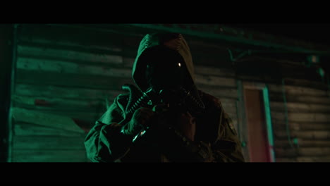 mysterious figure in gas mask