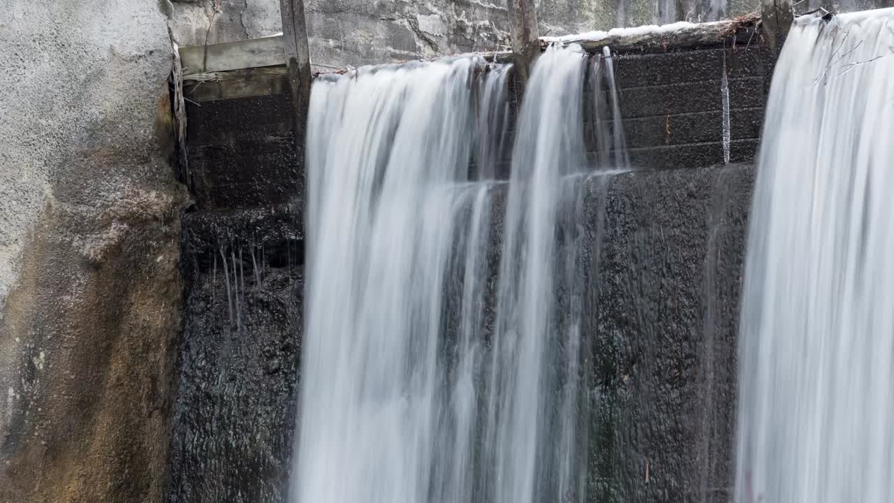 Water Cascading Over A Waterfall During Winter, Timelapse