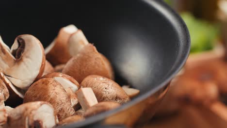 sliced mushrooms in a pan