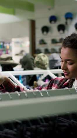 Woman Shopping for Winter Clothes in a Store