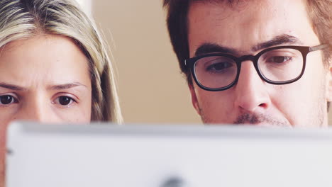 couple looking at a tablet