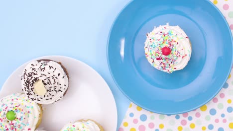 served cup cakes on plate on the table moving. stop motion