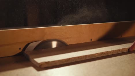 close up shot of an electric saw, which a man uses in his carpenter's workshop