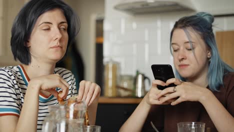 handheld video of offended lesbians during breakfast.