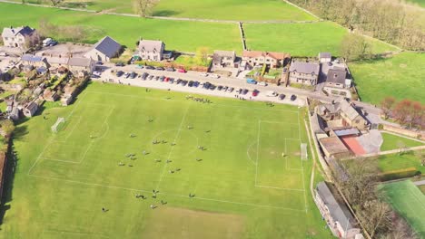 bakewell football club, england - aerial tilt down shot over players