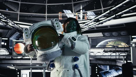cheerful astronaut holding helmet doing human expansion in space
