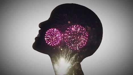 cabeza de silueta con fuegos artificiales