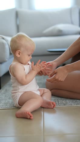 baby girl playing and clapping