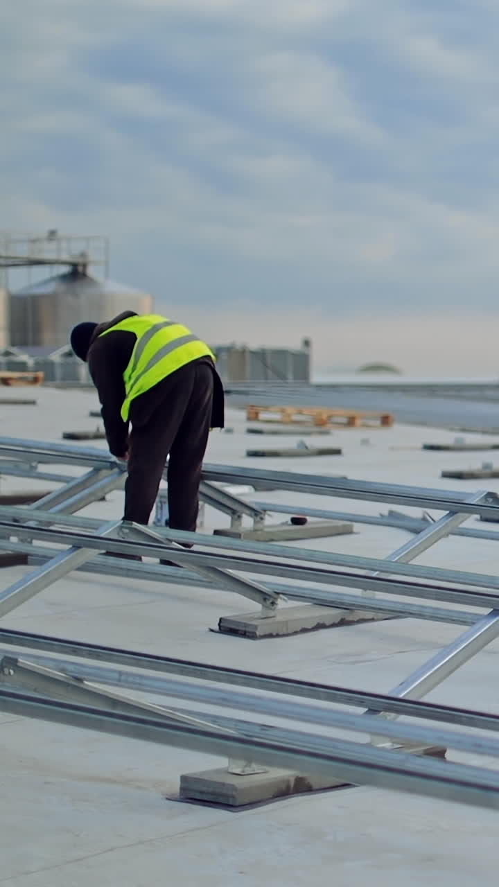 Alternative energy and professional construction. Rooftop solar panel mounting structure installation