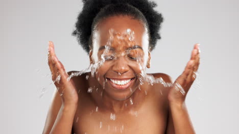 face, skincare and laughing black woman with water