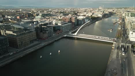 aerial view of samuel beckett bridge spanning the liffey river in dublin, ireland.