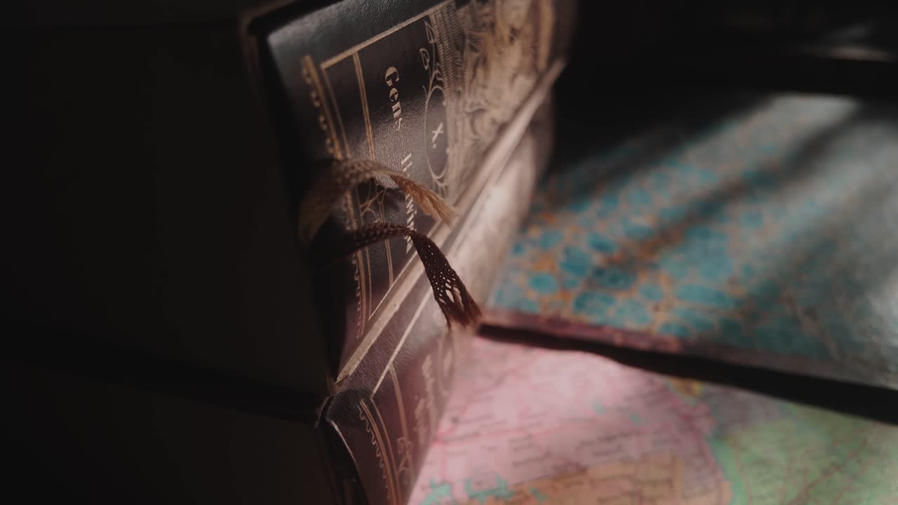 Sunlight falls on hard backed literature books in home library CLOSE-UP