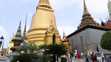 visitors explore bangkok's iconic pagoda and temple