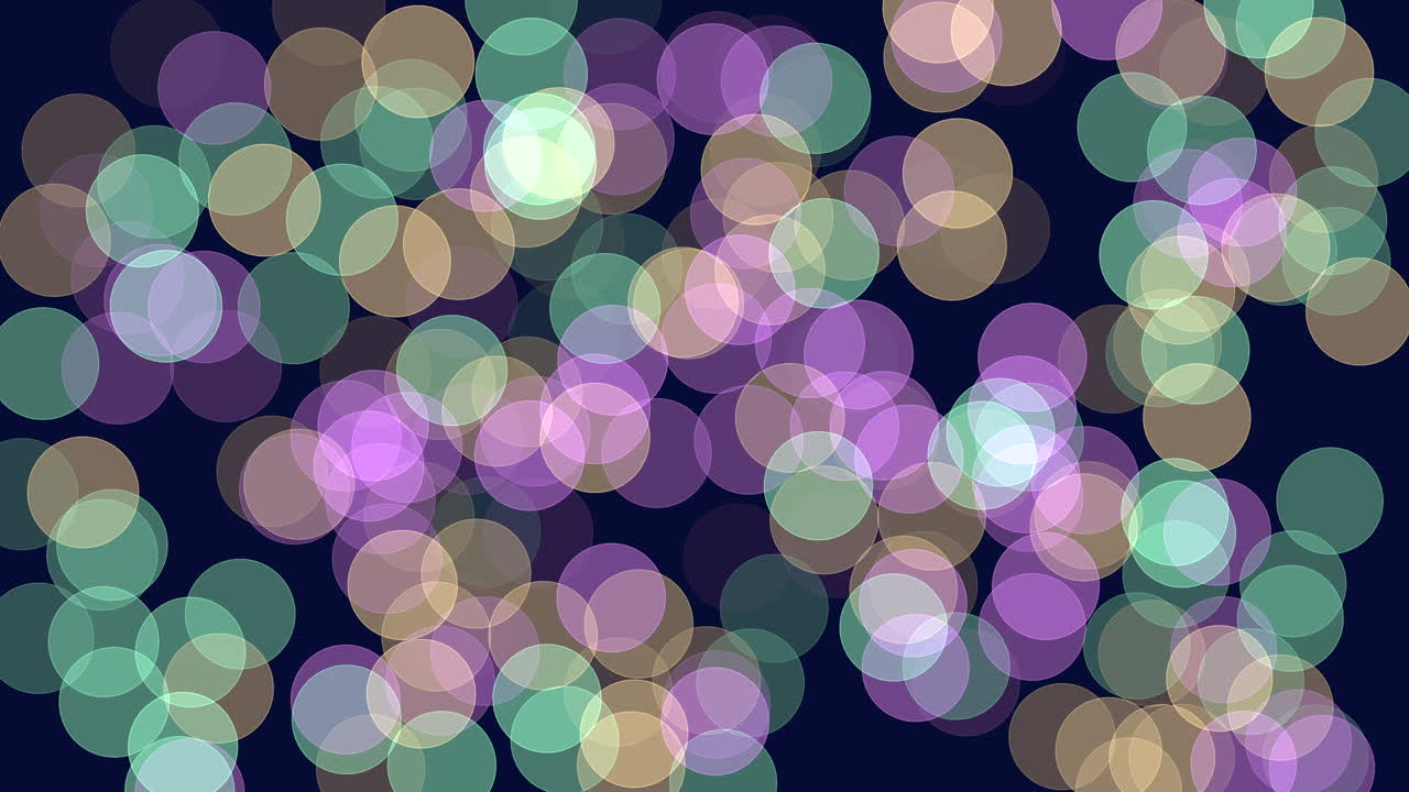 Circular pattern of varying shades of purple, blue, and green circles on a dark background, showcasing overlapping designs that create a visually striking and harmonious composition