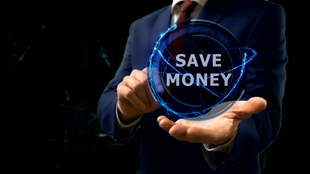 Businessman shows concept hologram Save money on his hand