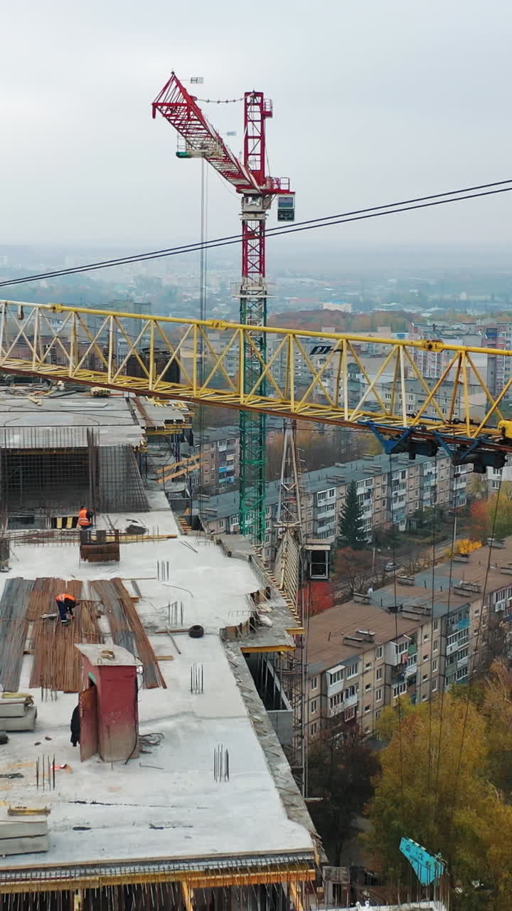 Construction of a residential apartment complex. Aerial view. Vertical video
