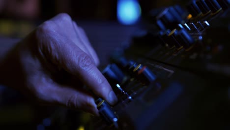 sound engineer working at a mixing desk