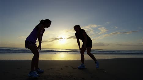 american females outdoor on beach with sport watch