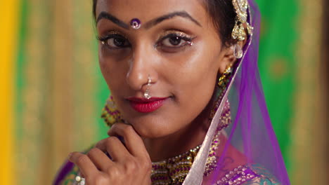 Close-Up-Portrait-Of-Female-Kathak-Dancer-Performing-Dance-Wearing-Traditional-Indian-Dress-And-Jewellery-Looking-At-Camera-4