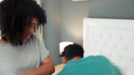 Bedroom,-pillow-fight-and-couple-in-a-happy