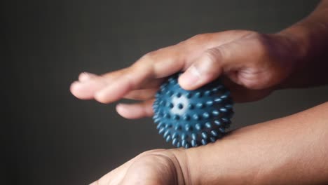 massaging wrist with therapy ball