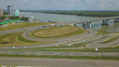 just married people over highway against river aerial