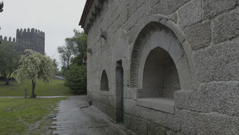 ancient stone building and castle under a rainy sky