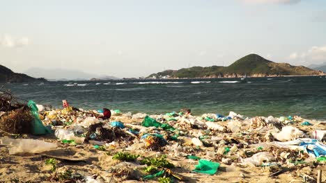 phu hung beach polluted by trash from fish farm on binh hung island, vietnam