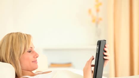 Blondhaired-woman-using-a-tablet
