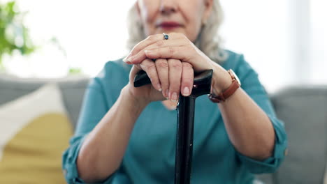 Hands,-cane-and-senior-woman-with-walking-stick