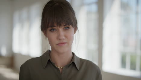 close up portrait of young beautiful woman looking pensive at camera cute caucasian female serious