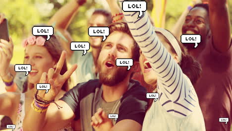 multiple lol text on speech bubbles floating against couple taking a selfie at concert