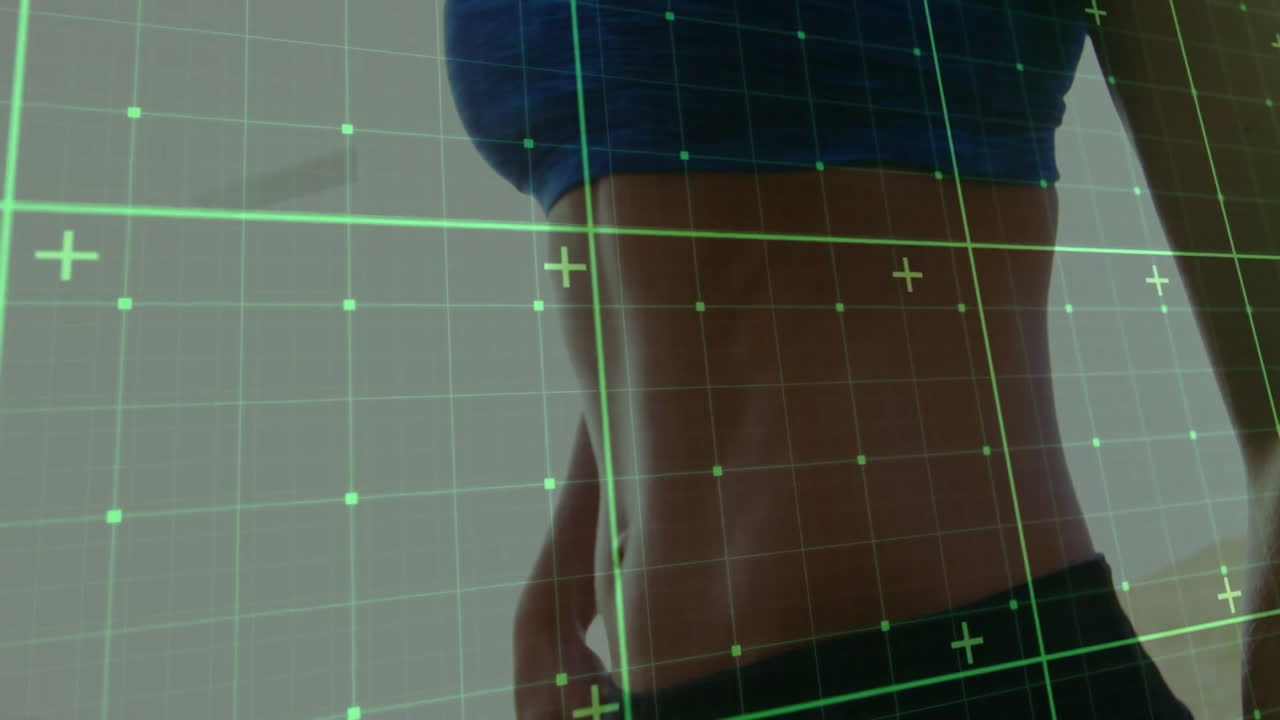 Grid overlay animation on toned abdomen of person in fitness setting