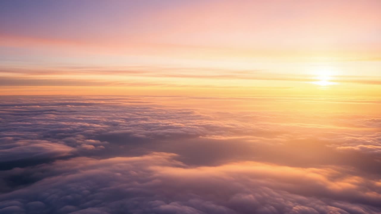 A Serene Display of Colors: Captivating Sunrise Over Soft, Fluffy Clouds Illuminated by the Gentle Light of Dawn in a Tranquil Sky