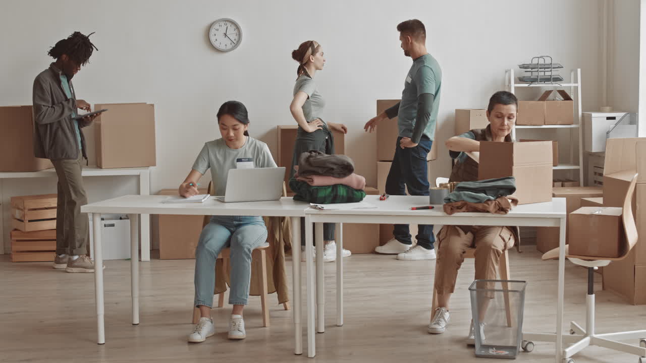 Volunteers Packing Donations in Warehouse