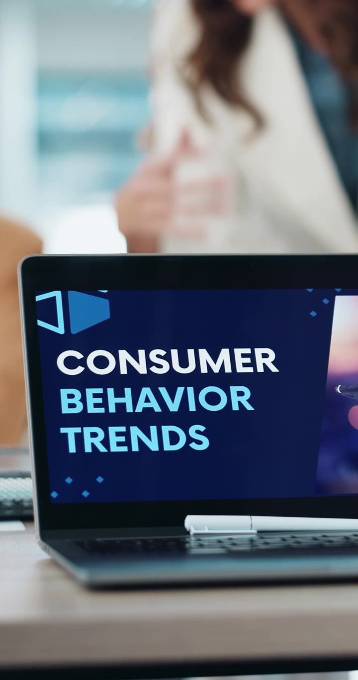 Laptop Displaying Consumer Behavior Trends Presentation in Office