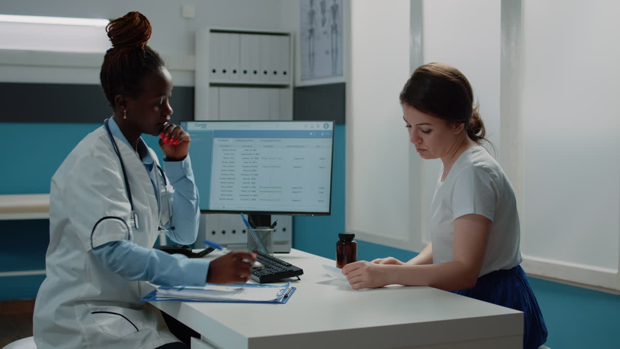 Doctor consulting with patient in medical clinic