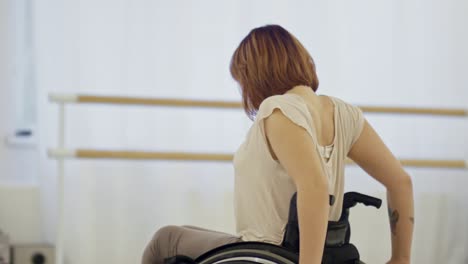 female dancer exercising in wheelchair