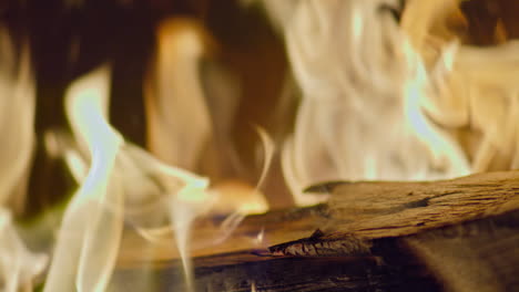 Slow-motion-shot-of-flames-and-embers-in-a-fireplace