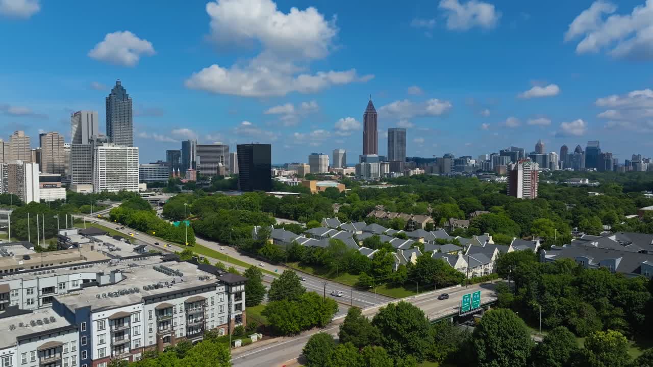 Aerial View Of Highway, Green Trees, Houses with Downtown Atlanta In Georgia, USA