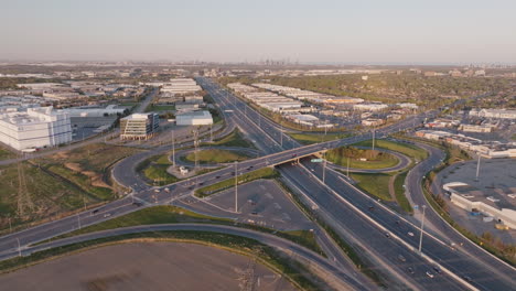 the 401 highway in mississauga with surrounding industrial buildings, aerial view